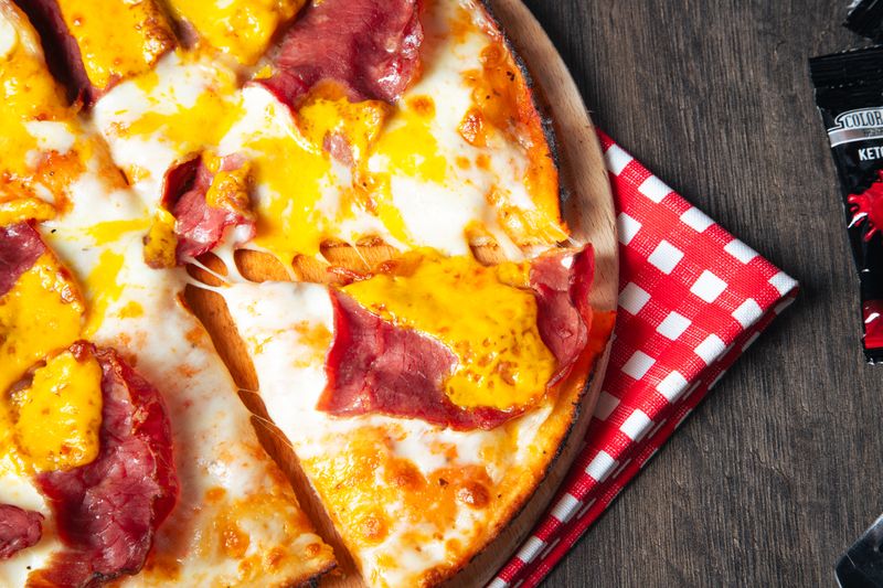 Hawaiian pizza with ham pineapple and mozzarella