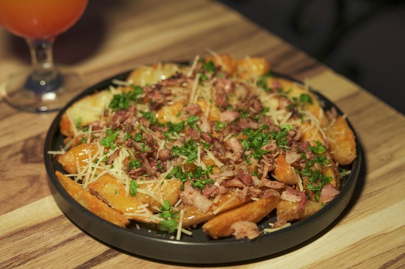 Loaded potato wedges with sour cream and cheese