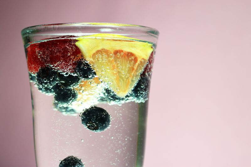 Sparkling water with citrus garnish